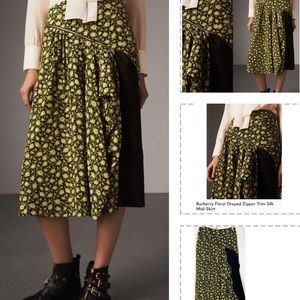 BURBERRY FLORAL SILK MEDI WITH UNIQUE ZIPPER DETAILING SHOWING A BLACK LINING